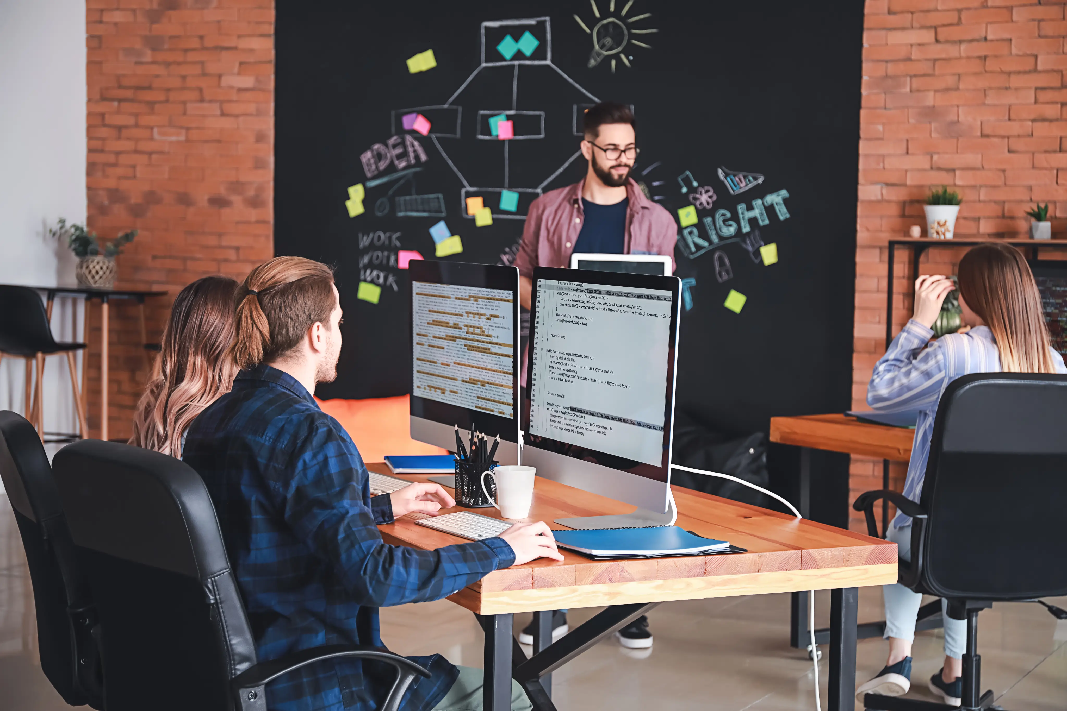 Man presenting to co-workers