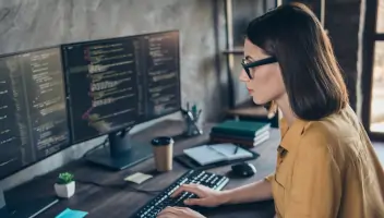 Man working with keyboard and monitor